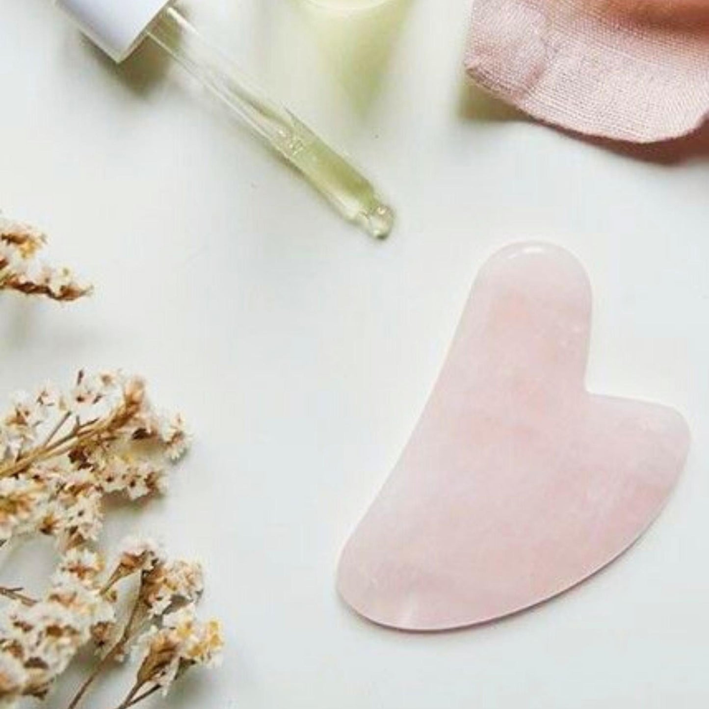 Gua Sha massaging lifting rose quartz tool - Unik by Nature